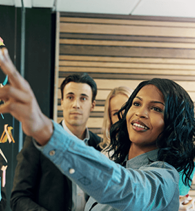 Woman explaining the plan to office team