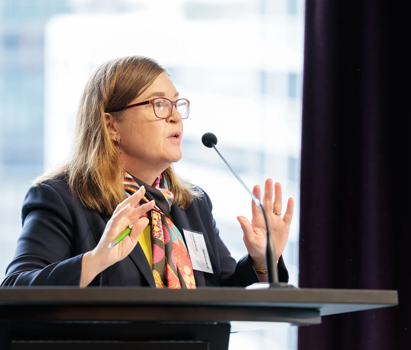 Woman speaking in a conference room